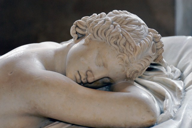 Detail of head. Greek marble, 2nd century A.D. Roman copy after a Hellenistic original of the 2nd century B.C. Restored in 1619 by David Larique. Mattress made of Carrara marble by Gianlorenzo Bernini in 1619 on Cardinal Borghese's request. L. 1.69 m (5 ft. 6 1/2 in.), W. 89 cm (35 in.)  Louvre Museum, Paris< France. Accession number Ma 231 (MR 220). --- Image by © Corbis